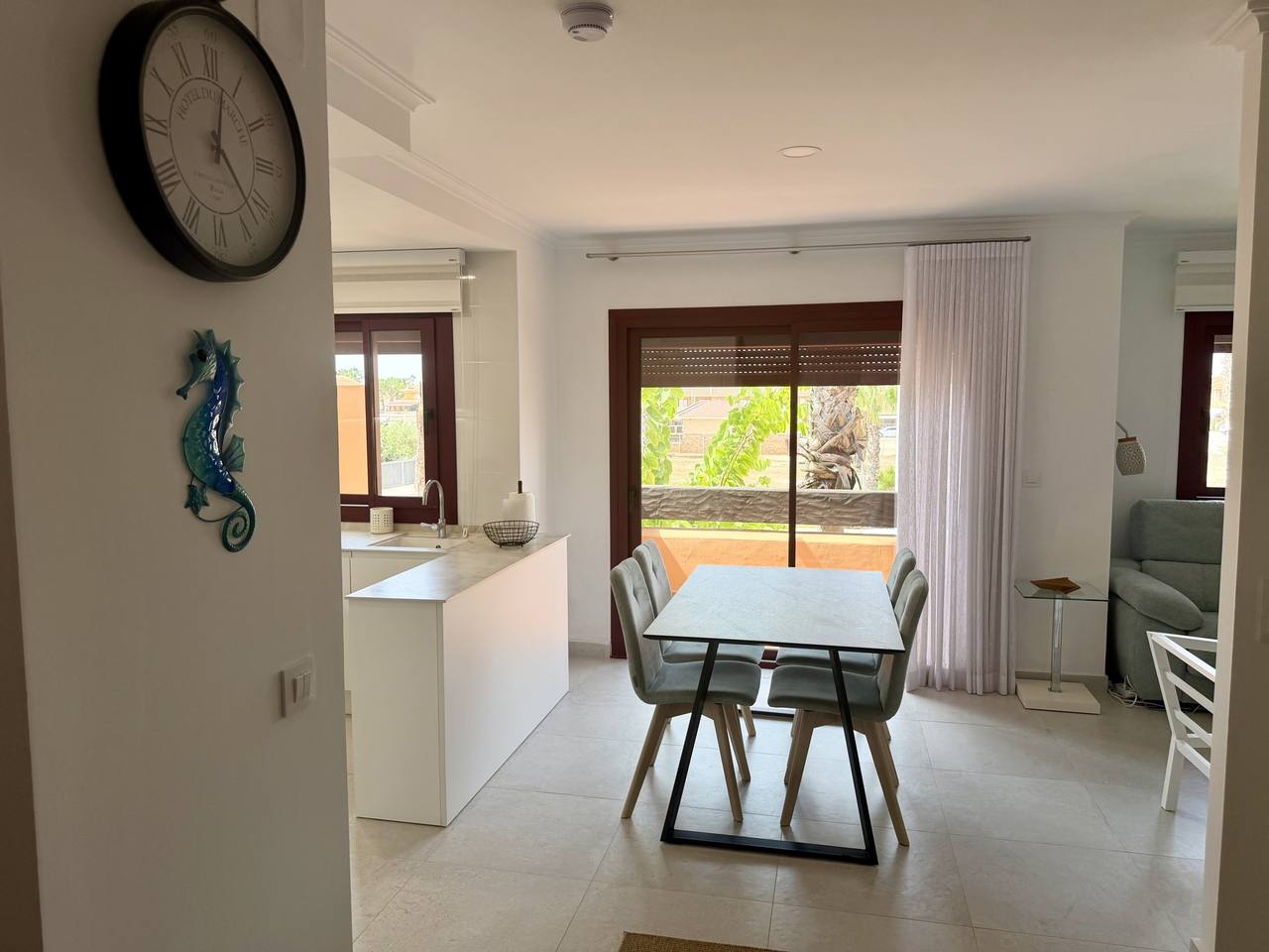 Open-plan living room with marble dining table